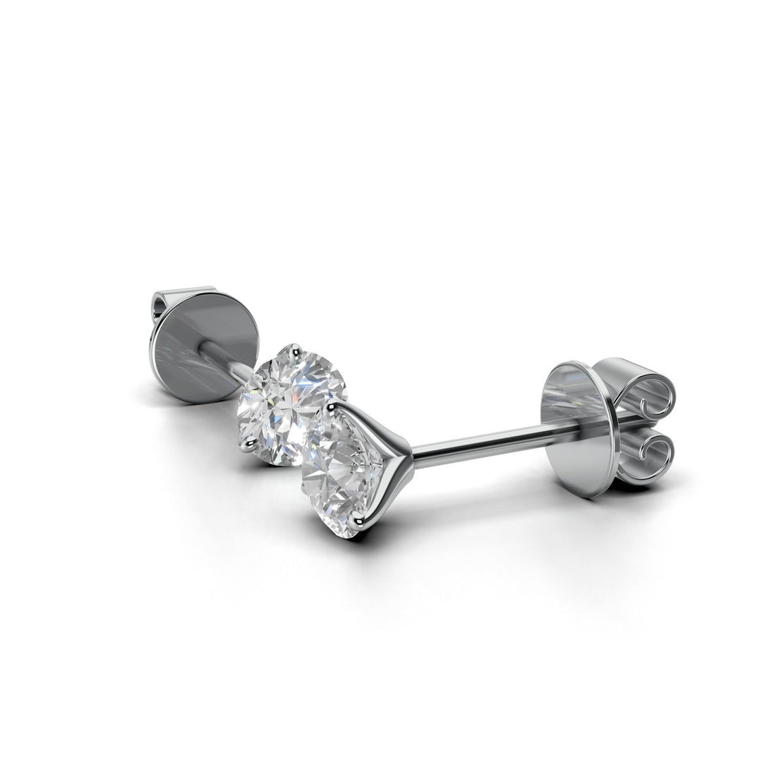 Pair of 0.7 carat total round lab-grown diamond martini stud earrings with secure backings