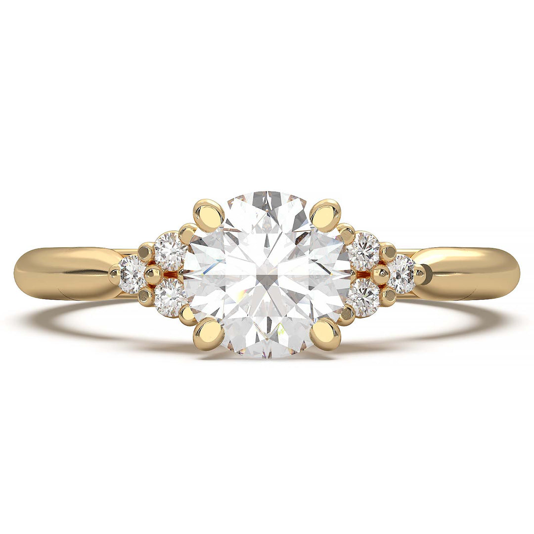 Round lab-grown diamond cluster engagement ring with a low-profile setting and accent diamonds.