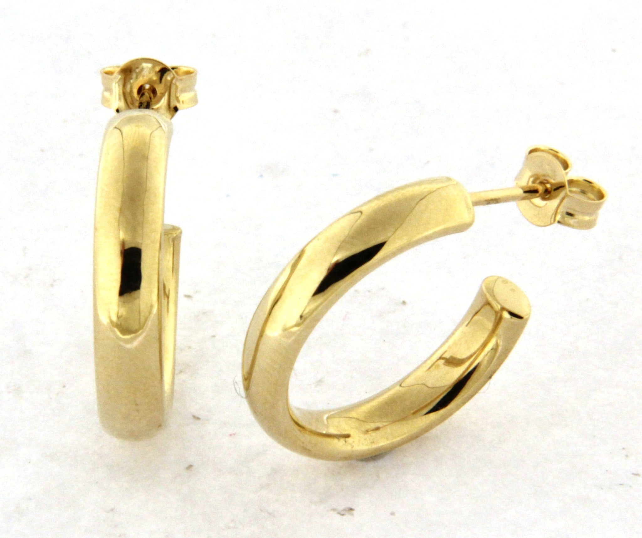 10k yellow gold polished hoop earrings with a smooth finish and stud-back closure.