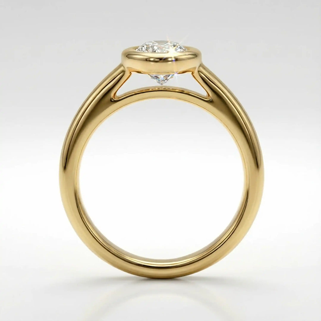 Marquise lab-grown diamond bezel engagement ring displayed on a soft surface.
