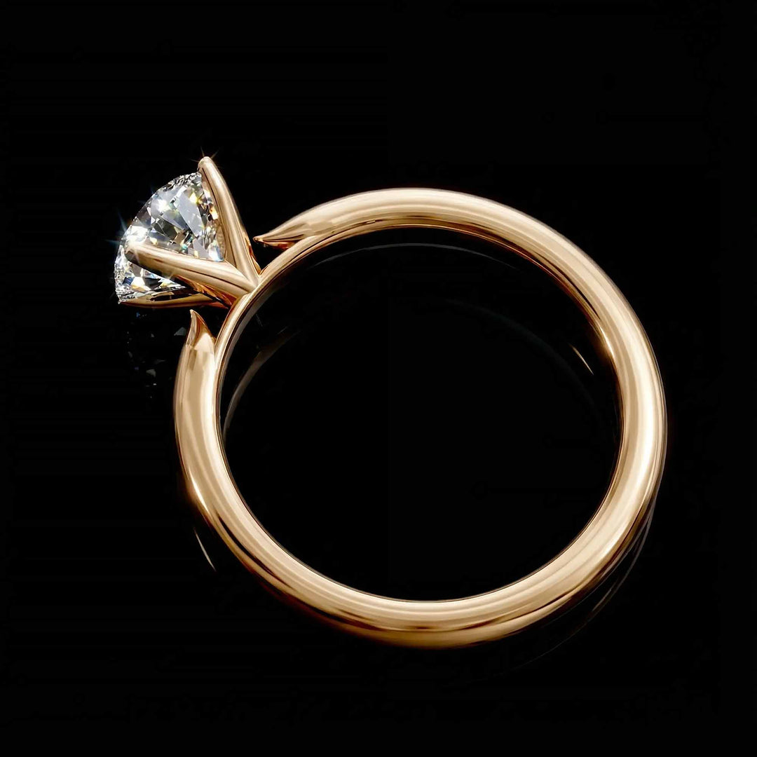 Round diamond cathedral solitaire engagement ring shown on reflective surface.