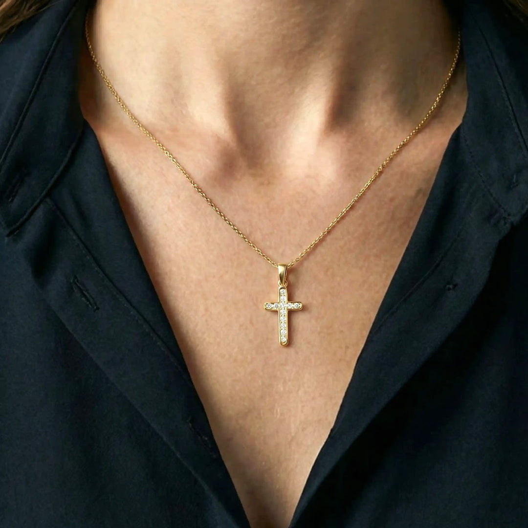 Minimal Latin Yellow Gold Cross Pendant worn on womens chest