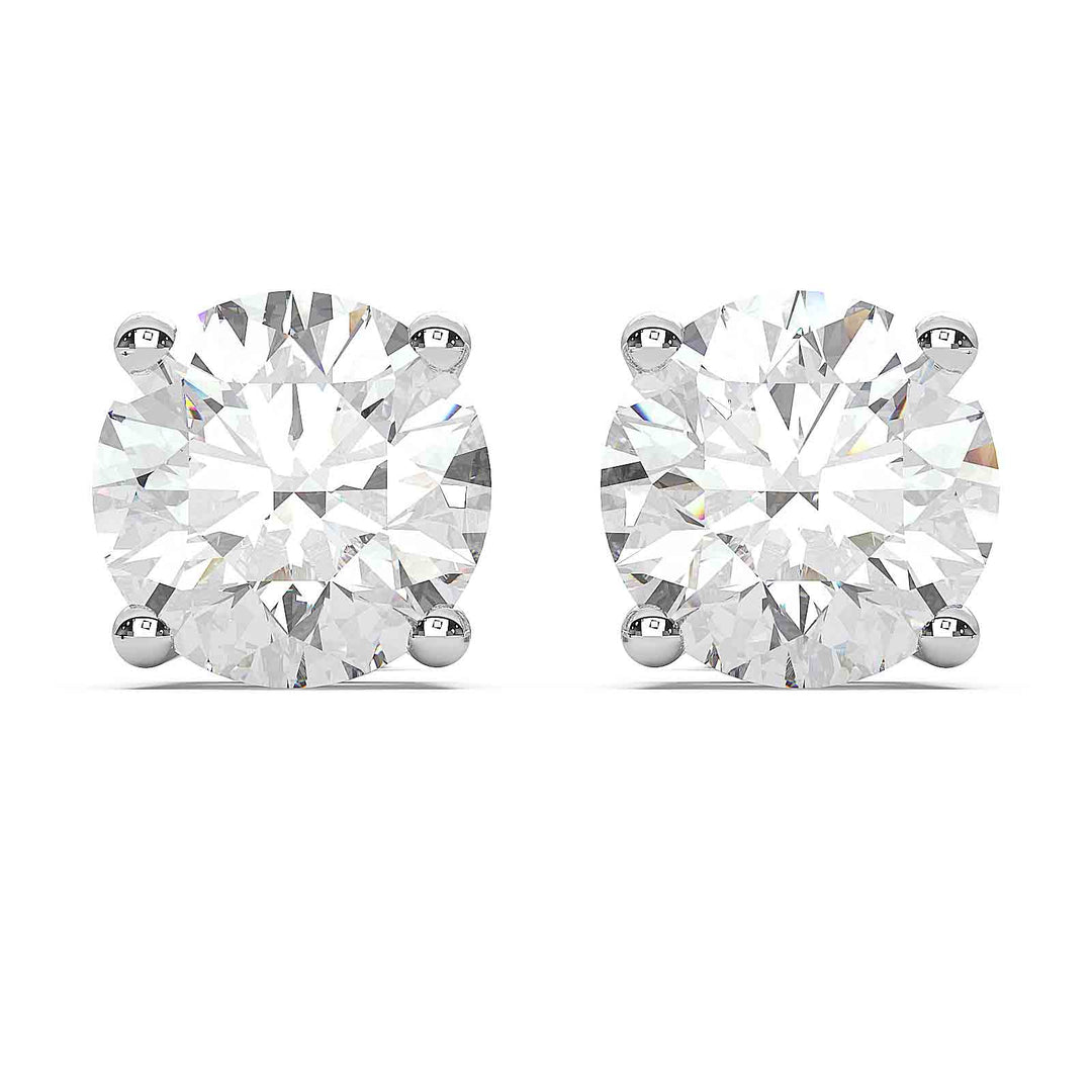 Close-up of 2.5 carat total round lab-grown diamond stud earrings in a four-prong basket setting.