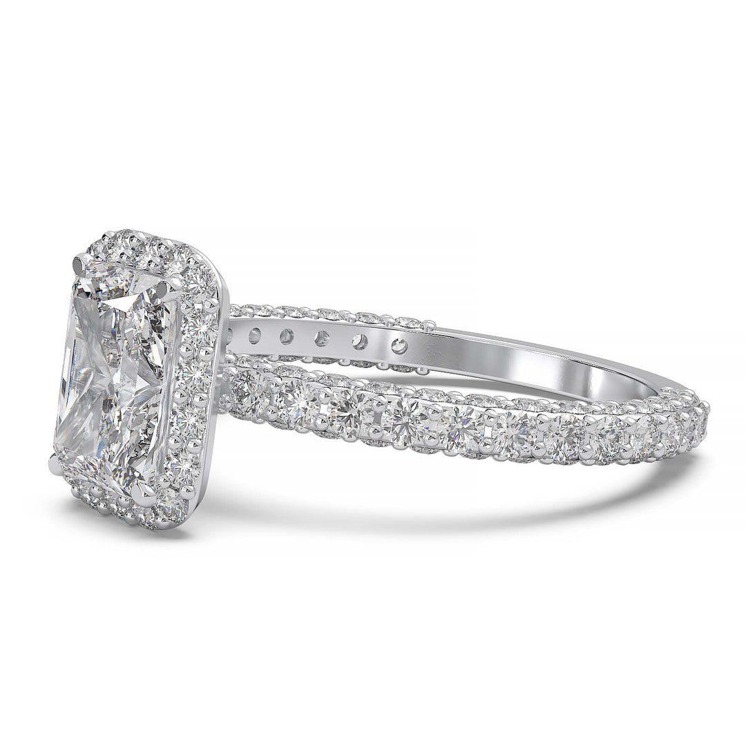 A 1.2-carat radiant-cut lab-grown diamond halo ring featuring a halo and triple row diamond band