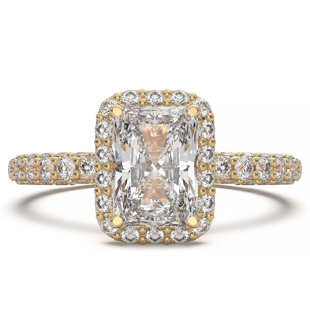 A 1.2-carat radiant-cut lab-grown diamond halo ring featuring a halo and triple row diamond band