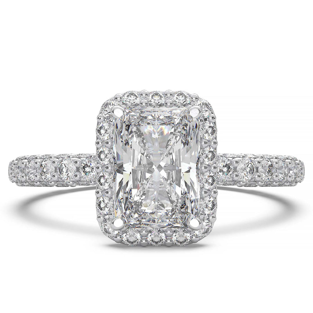 A 1.2-carat radiant-cut lab-grown diamond halo ring featuring a halo and triple row diamond band