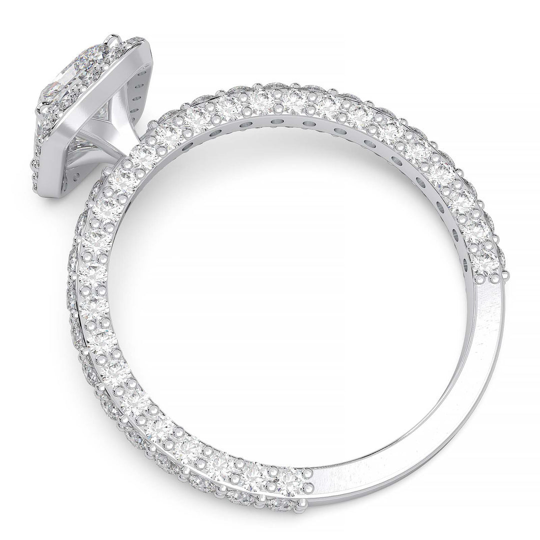 A 1.2-carat radiant-cut lab-grown diamond halo ring featuring a halo and triple row diamond band