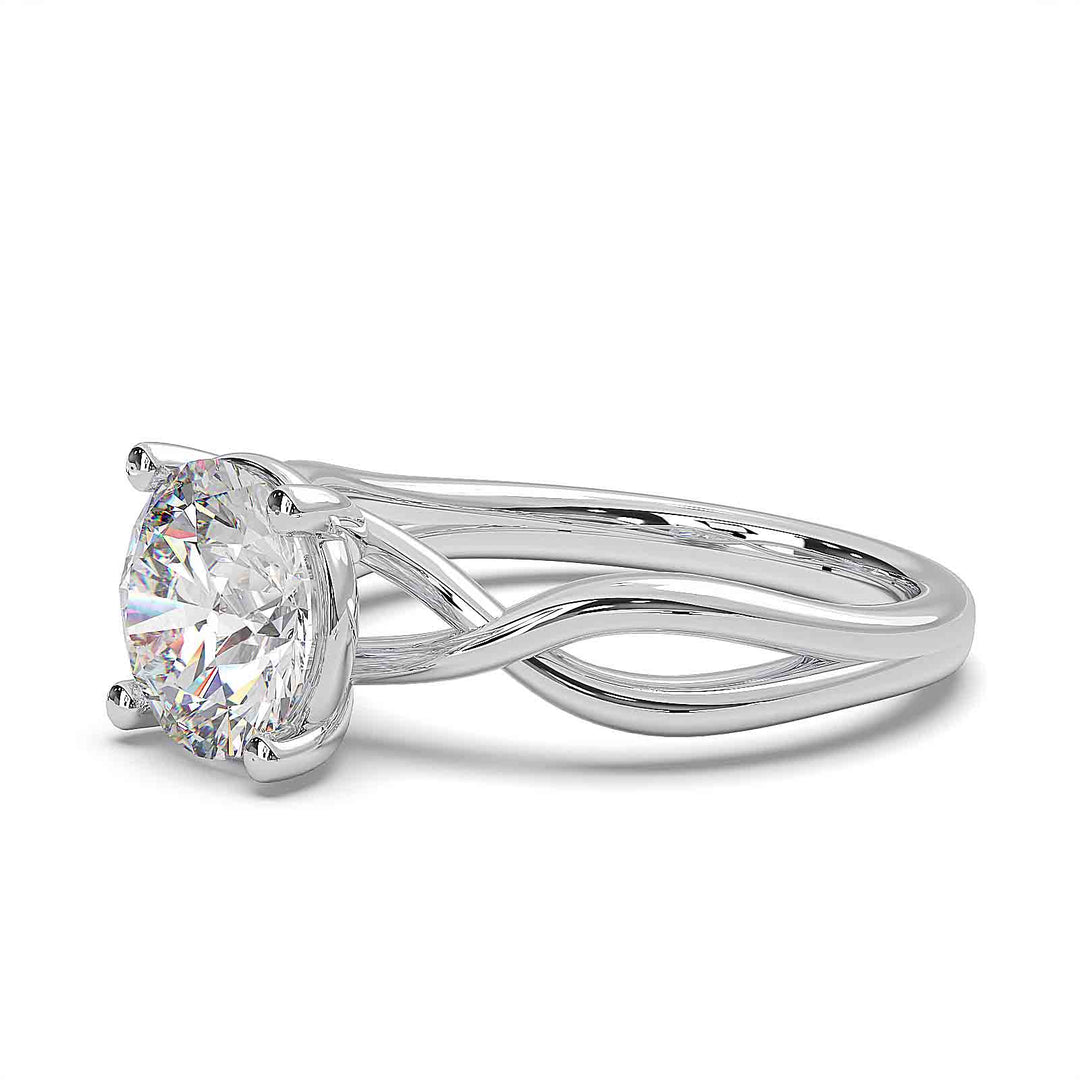 1.5-carat round diamond infinity twist engagement ring with low-profile setting.