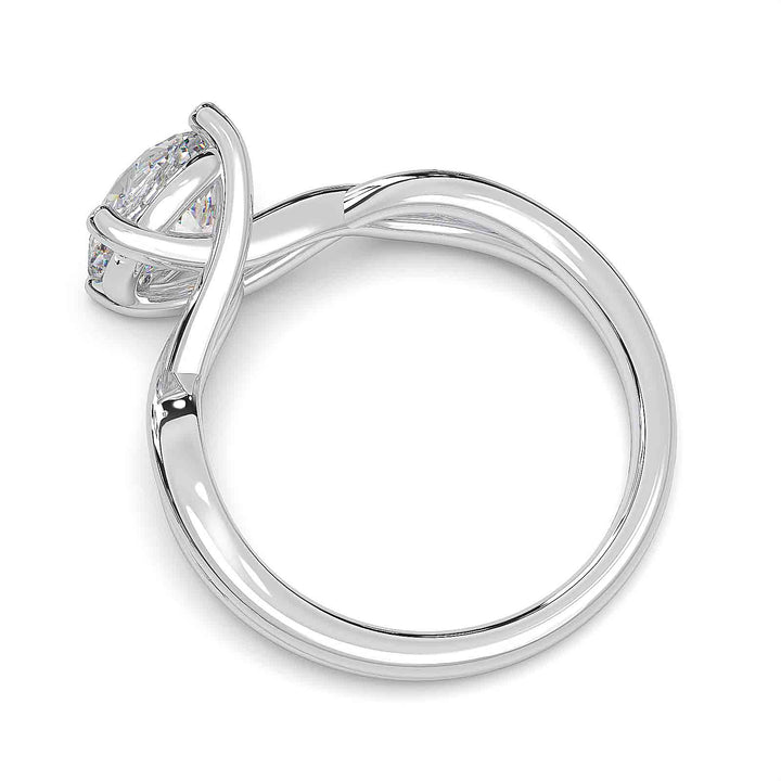 1.5-carat round diamond infinity twist engagement ring with low-profile setting.