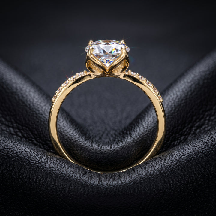 1.67CT round moissanite engagement ring with pave moissanite accents, set in 14K gold.