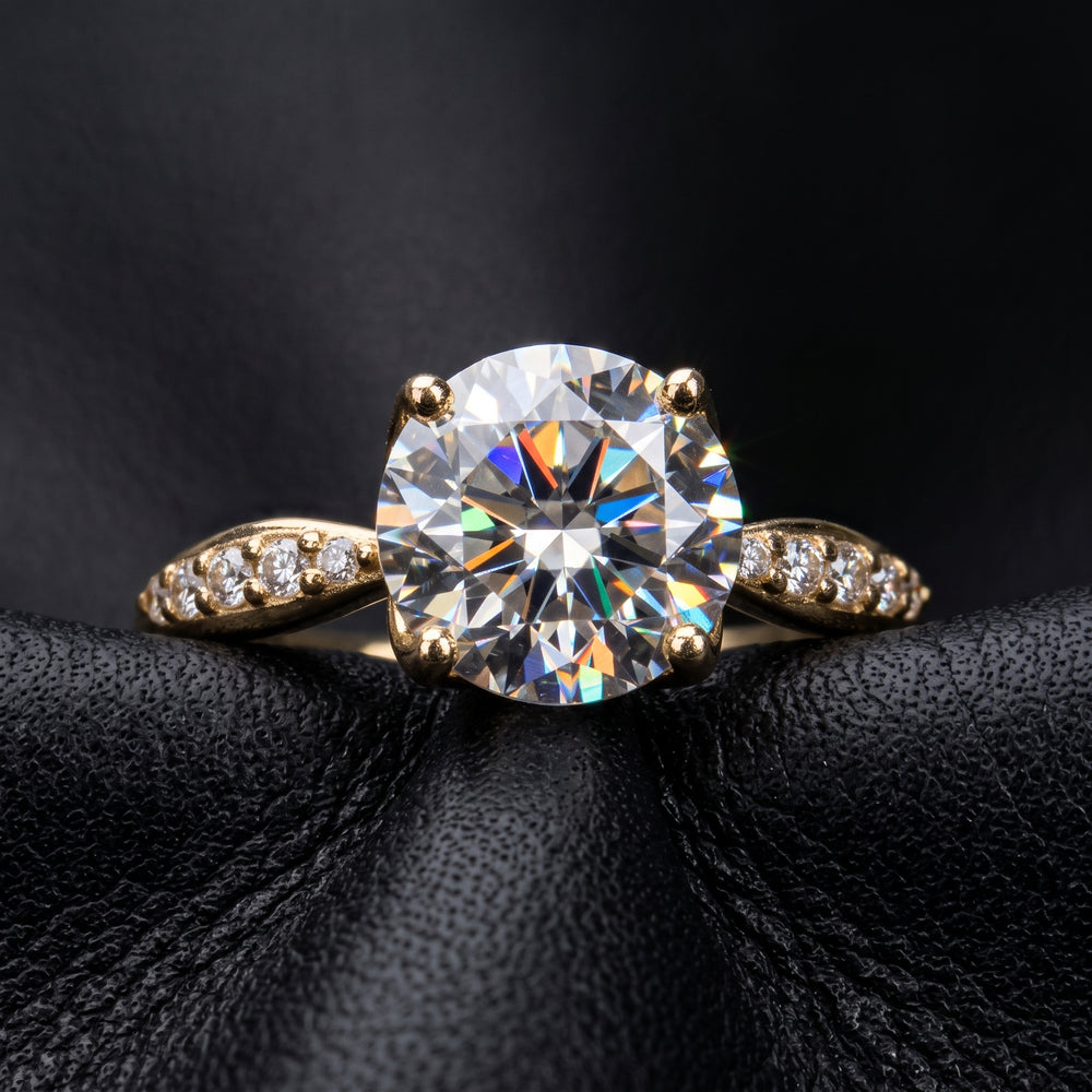 1.67CT round moissanite engagement ring with pave moissanite accents, set in 14K gold.