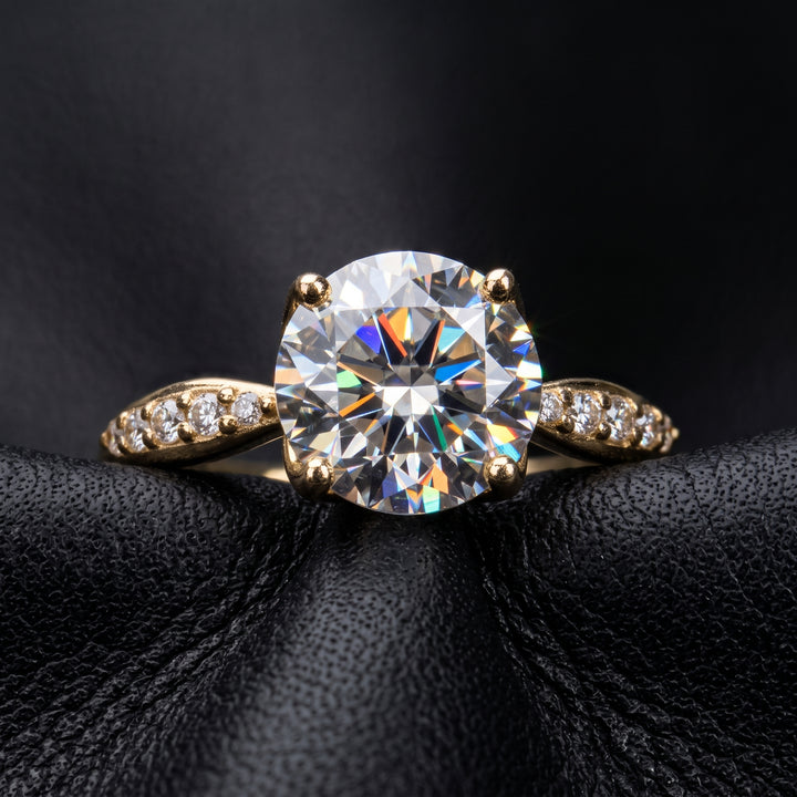 1.67CT round moissanite engagement ring with pave moissanite accents, set in 14K gold.