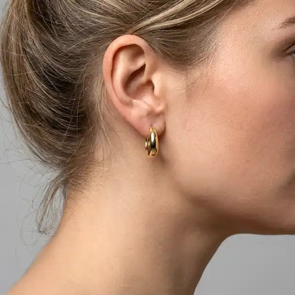 Yellow Gold Oval Huggie Earrings - worn on ear