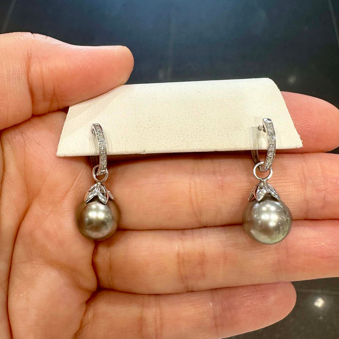 Light gray Tahitian pearl earrings with green overtone, 10.5mm round pearls set in 14K white gold with small diamonds.