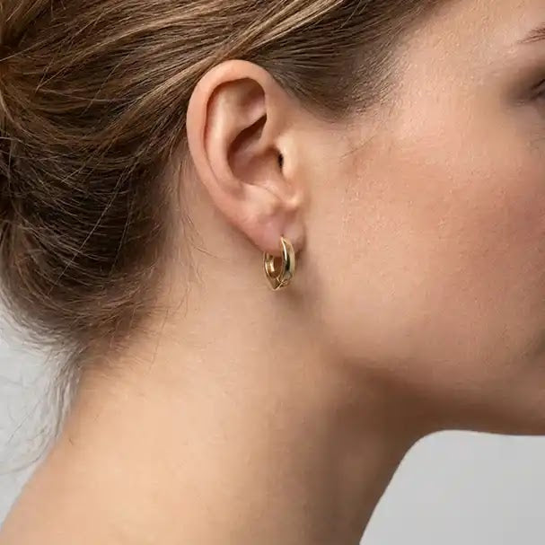 Yellow Gold Oval Huggie Earrings - worn on ear