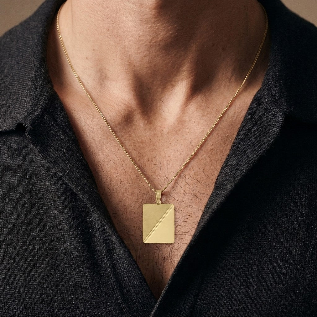 10K yellow gold rectangular tag pendant with diagonal satin and polished halves, 26.8 x 21 mm, 0.4 mm thick, worn by a man on a 22 inch chain