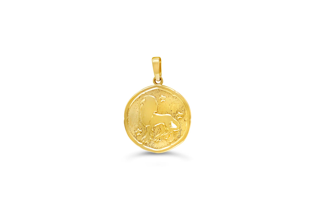 10K yellow gold Leo zodiac pendant: a round medallion with a lion raised in polished gold and small stars on a textured background
