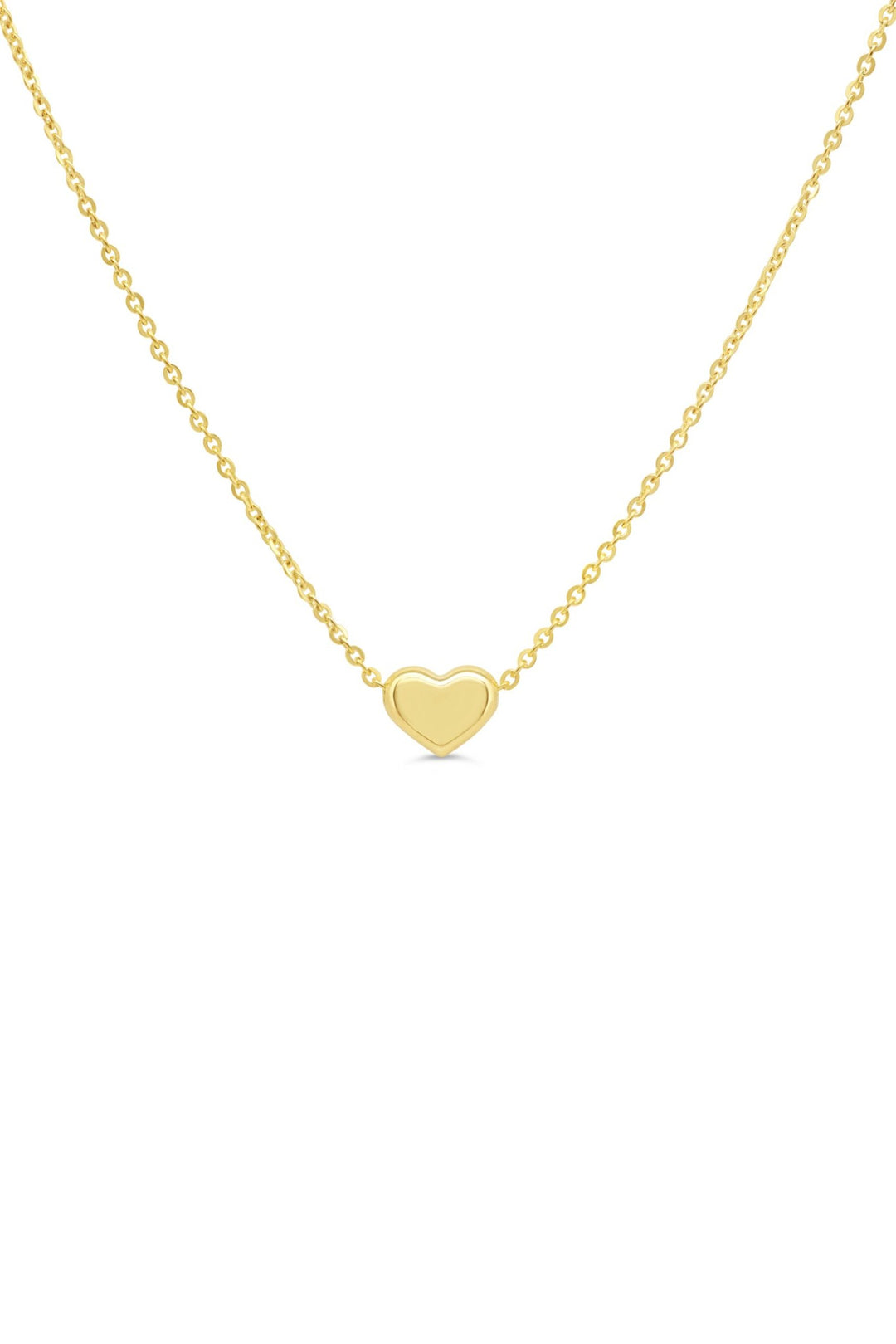 10K yellow gold necklace with a small puffed heart stationed on a fine chain