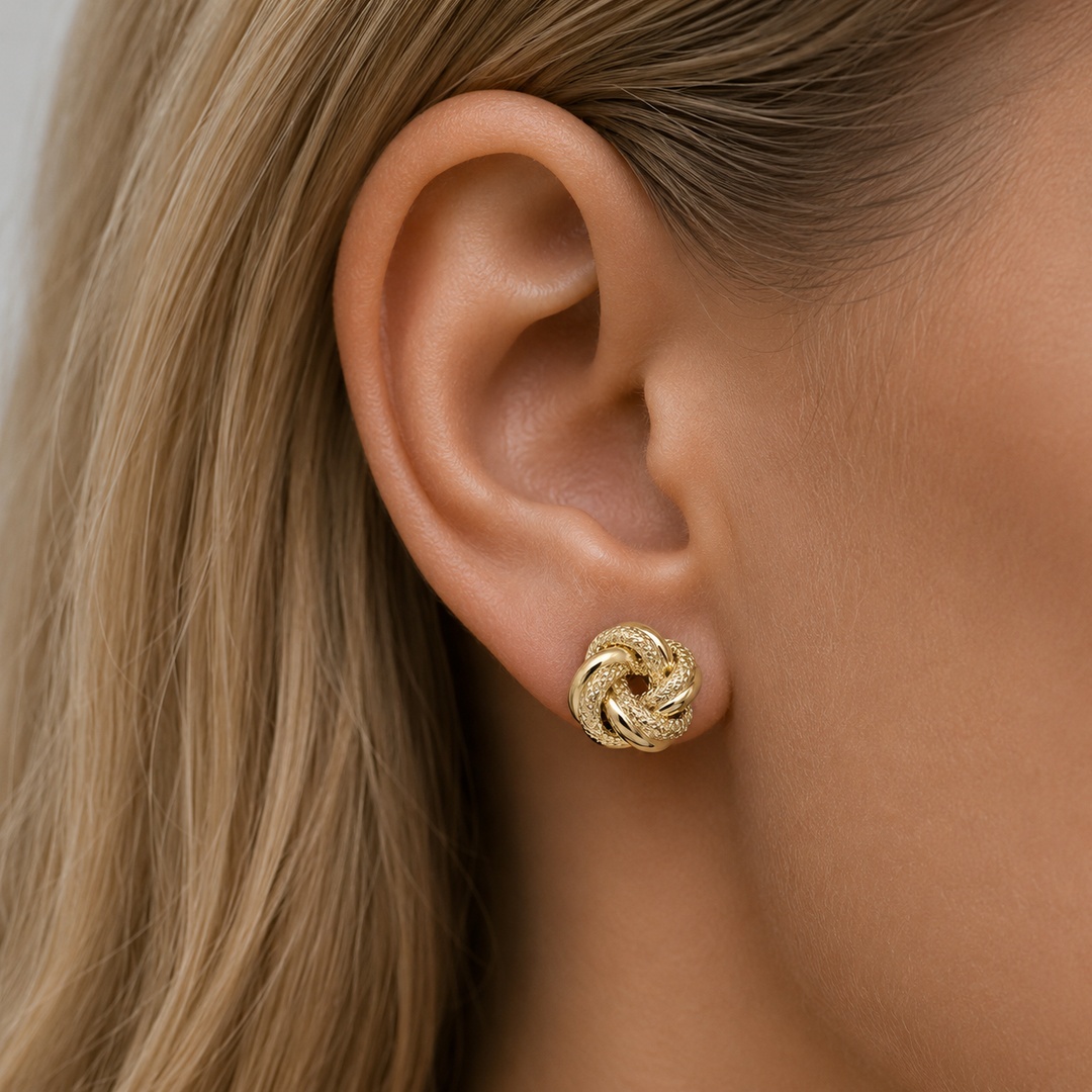 Yellow Gold Patterned Love Knot Earrings - worn on ear