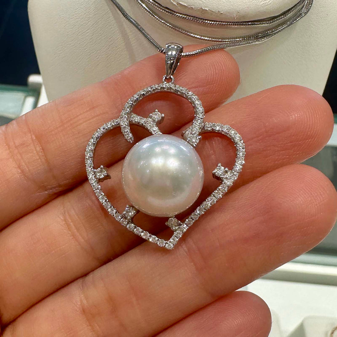 South Sea white pearl pendant with 13.4mm round pearl set in 18K white gold with 0.80 carat natural diamonds in a fancy setting.