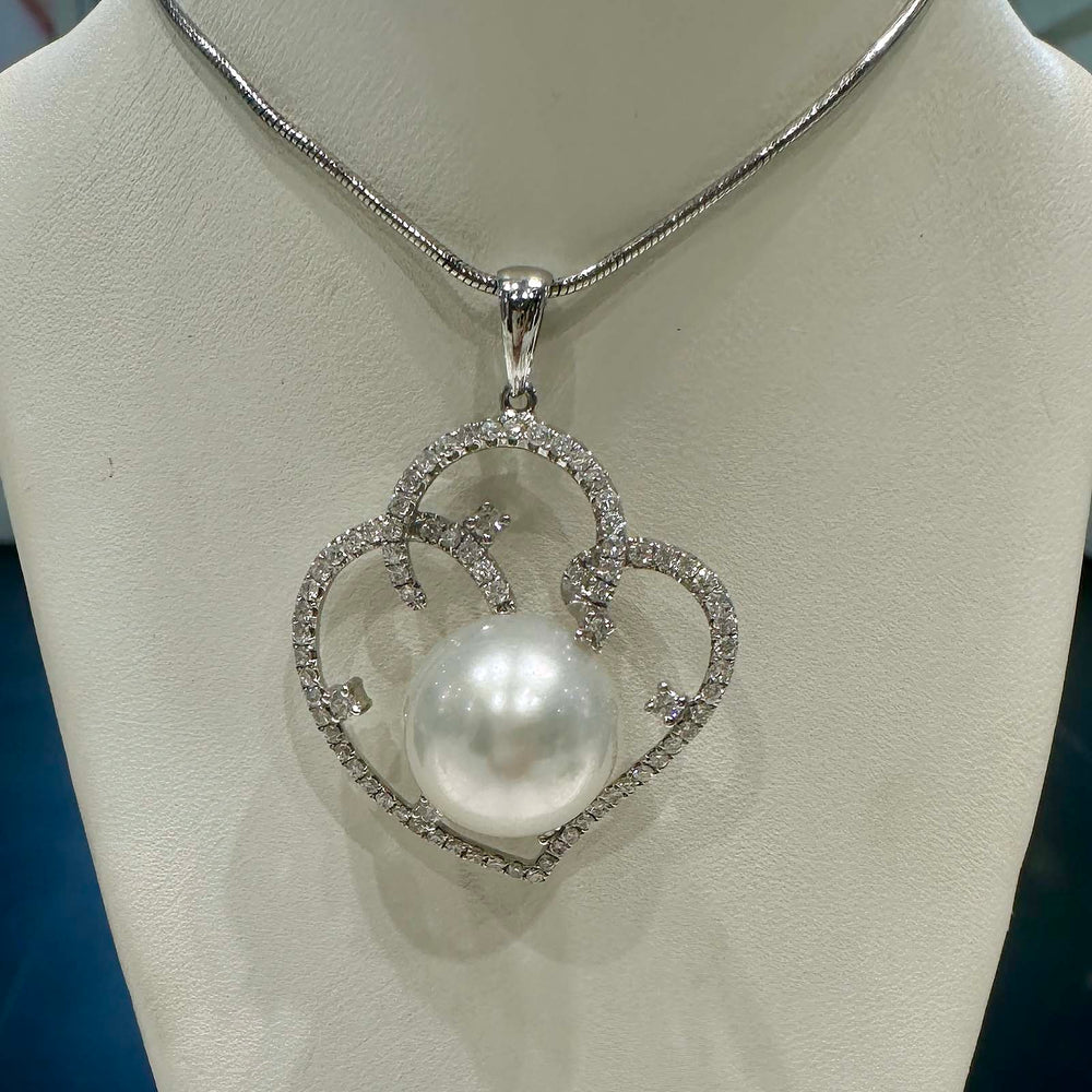 South Sea white pearl pendant with 13.4mm round pearl set in 18K white gold with 0.80 carat natural diamonds in a fancy setting.