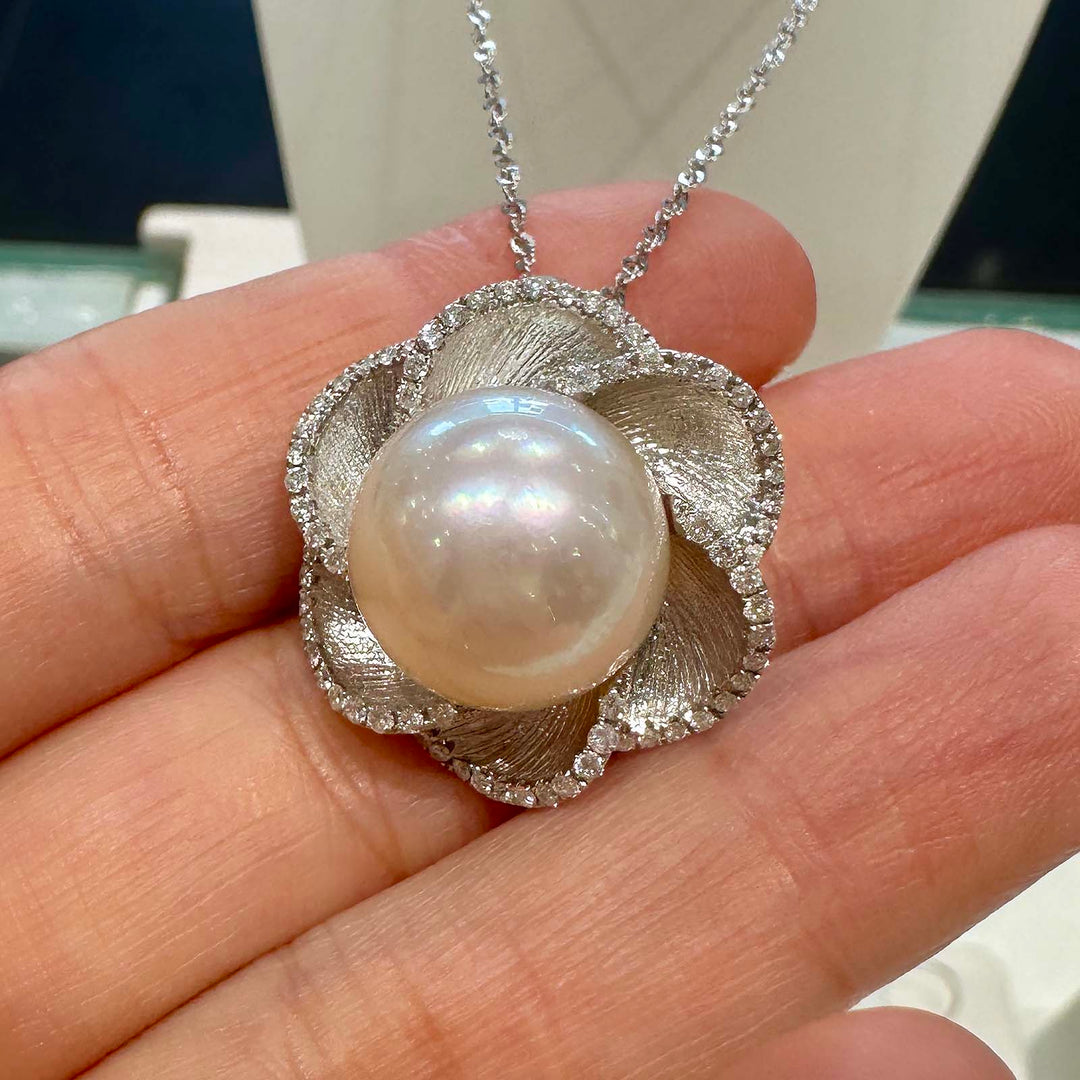 South Sea white pearl flower pendant with light rose cream overtone, 13.9mm round pearl set in 18K white gold with small diamonds.