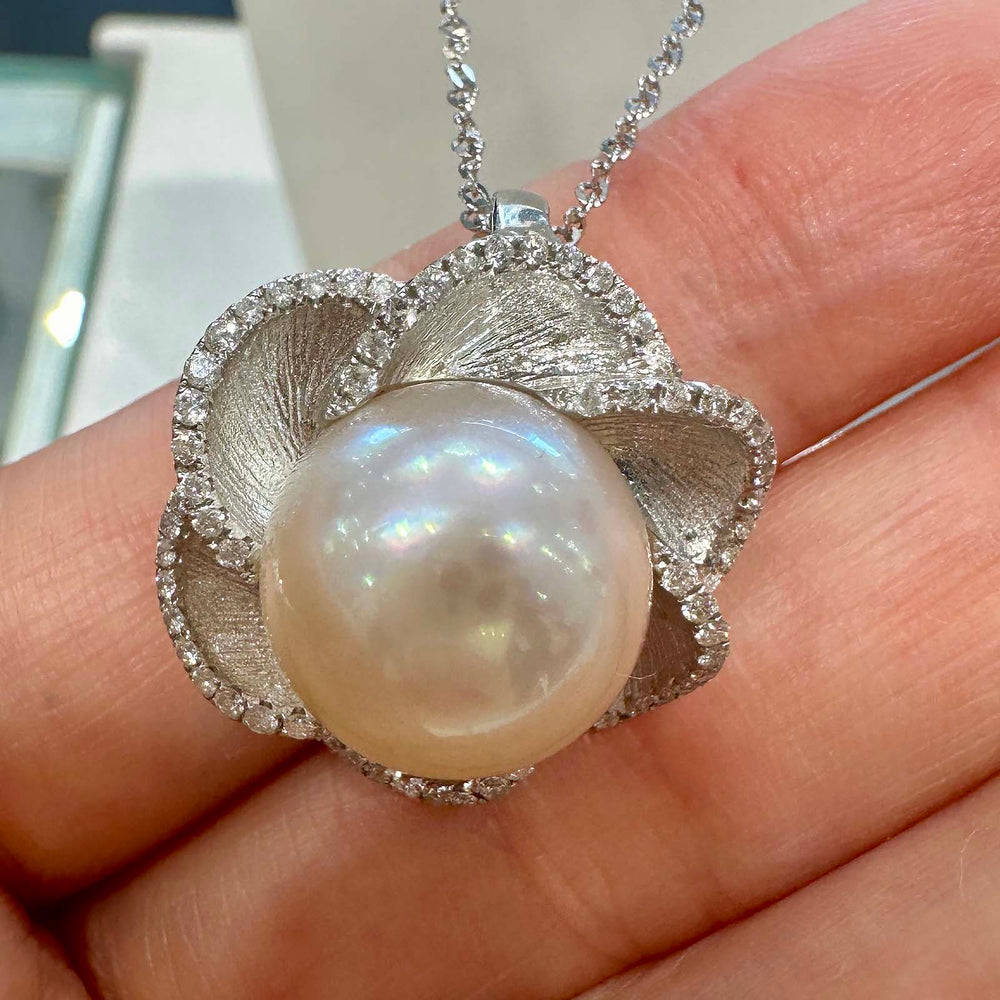 South Sea white pearl flower pendant with light rose cream overtone, 13.9mm round pearl set in 18K white gold with small diamonds.