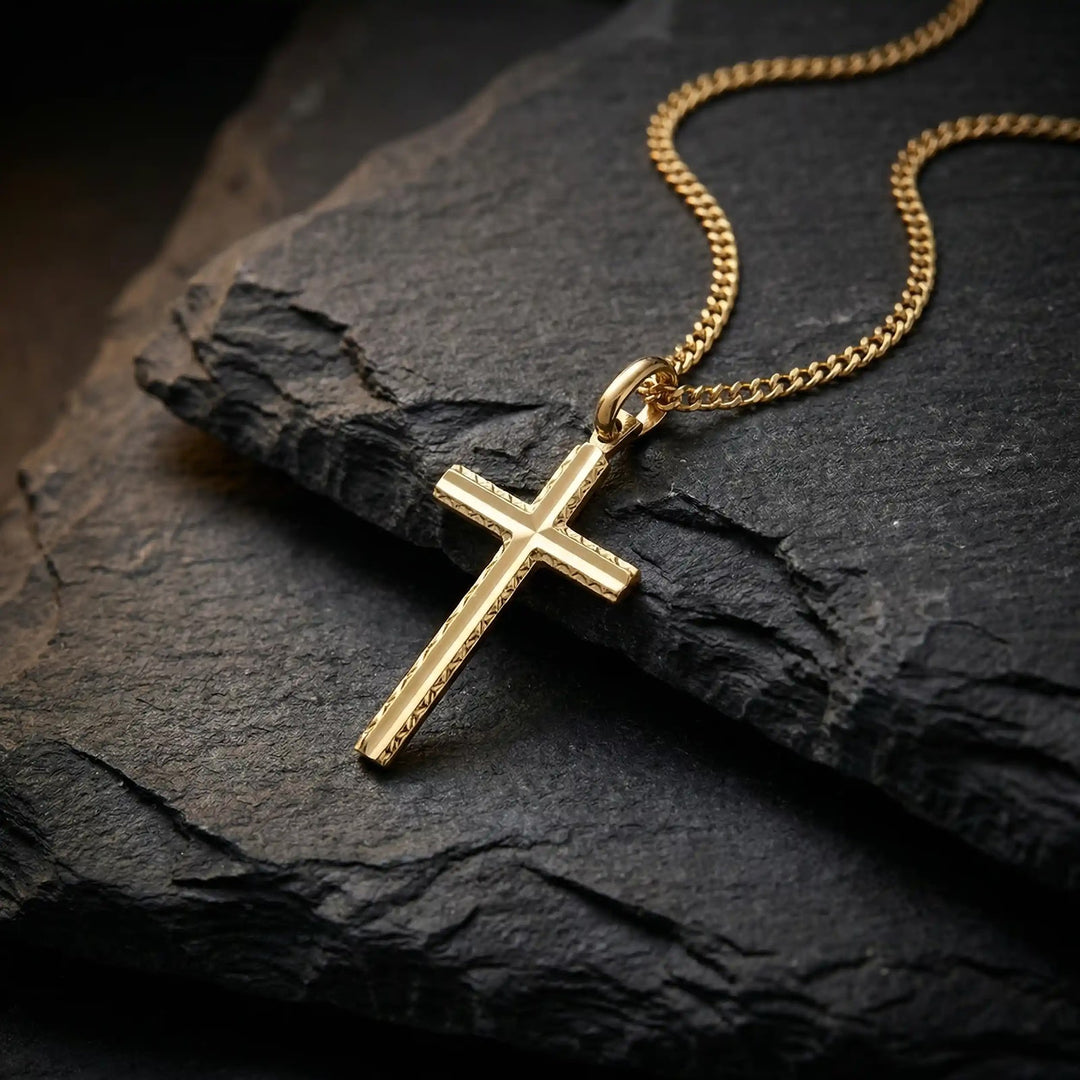 Textured Latin Yellow Gold Cross Pendant on stone