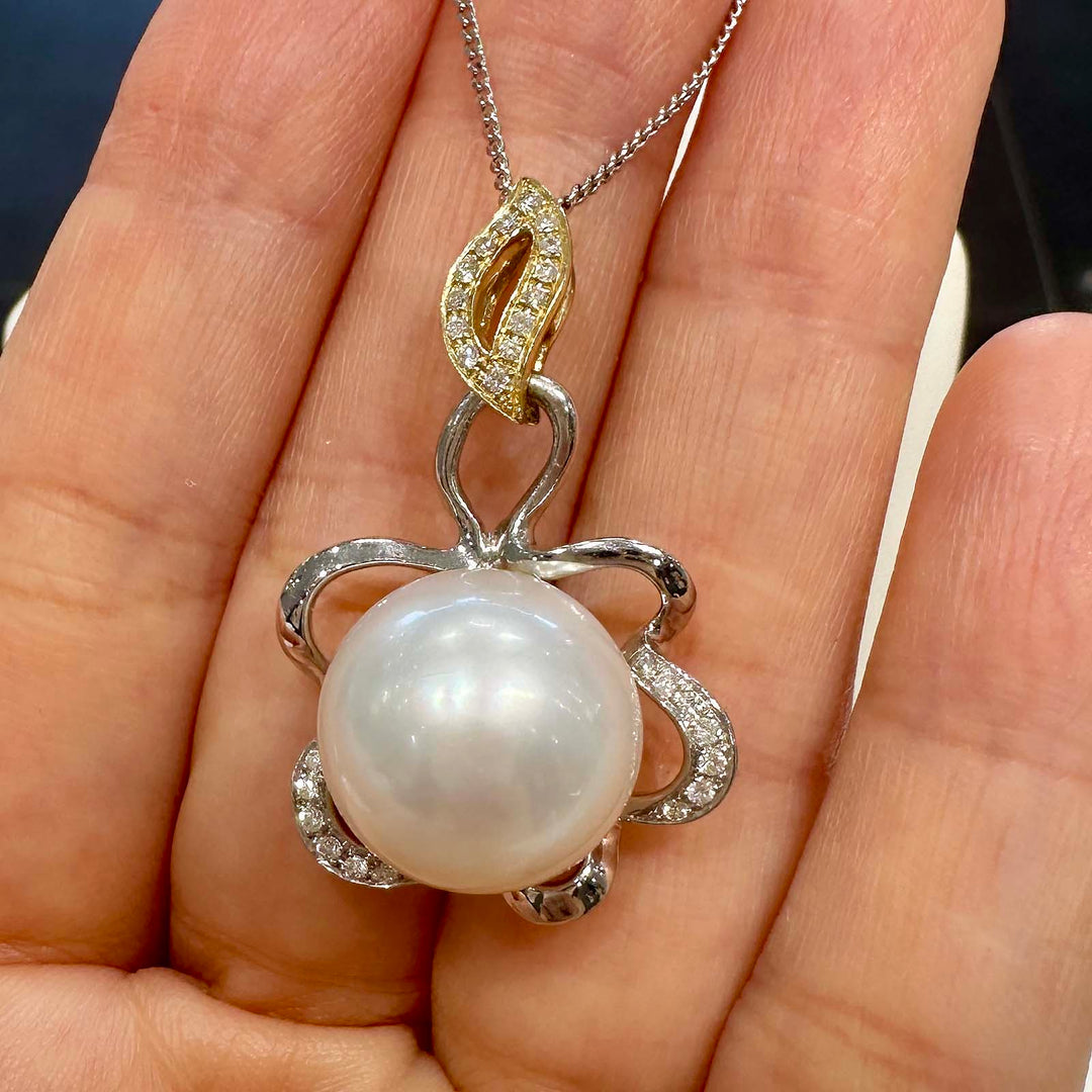 AAA South Sea pearl pendant with 14.5mm round pearl set in 14K white and yellow gold with small natural diamonds.