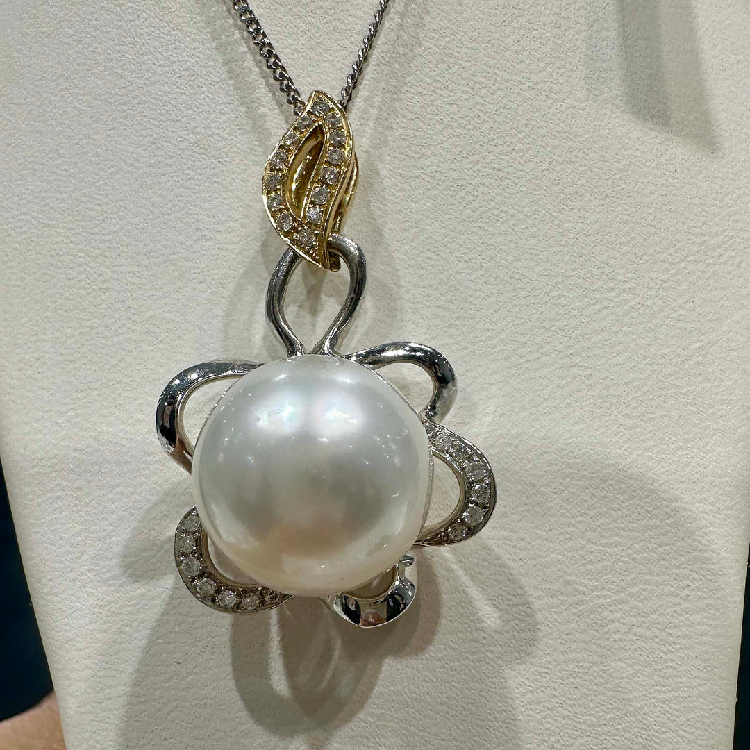 AAA South Sea pearl pendant with 14.5mm round pearl set in 14K white and yellow gold with small natural diamonds.