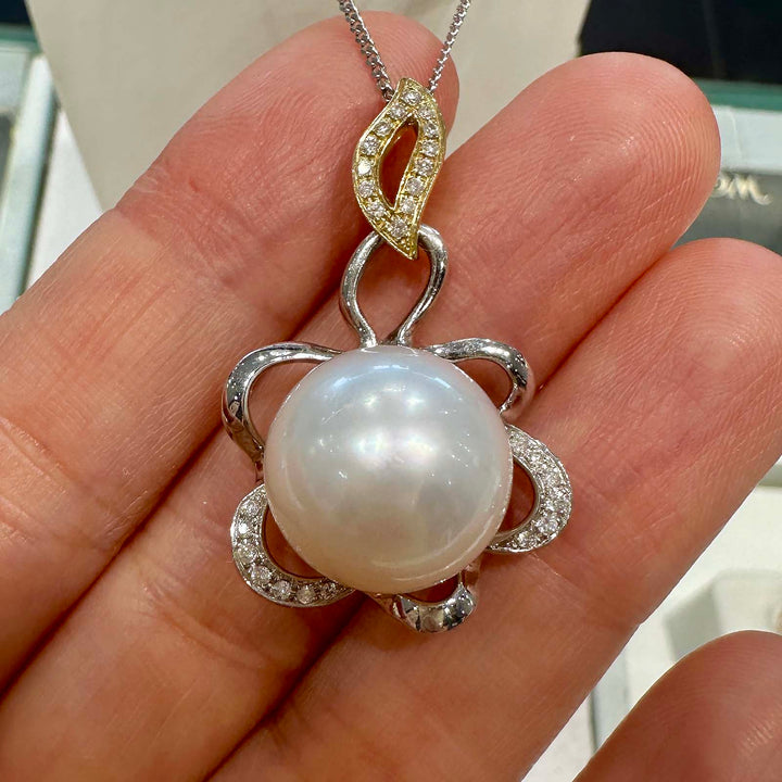 AAA South Sea pearl pendant with 14.5mm round pearl set in 14K white and yellow gold with small natural diamonds.