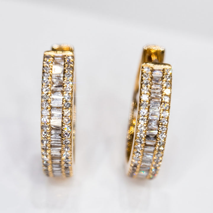 RUDIX 14k yellow gold natural diamond baguette huggie hoop earrings — pair standing front view, both parallel on white studio background