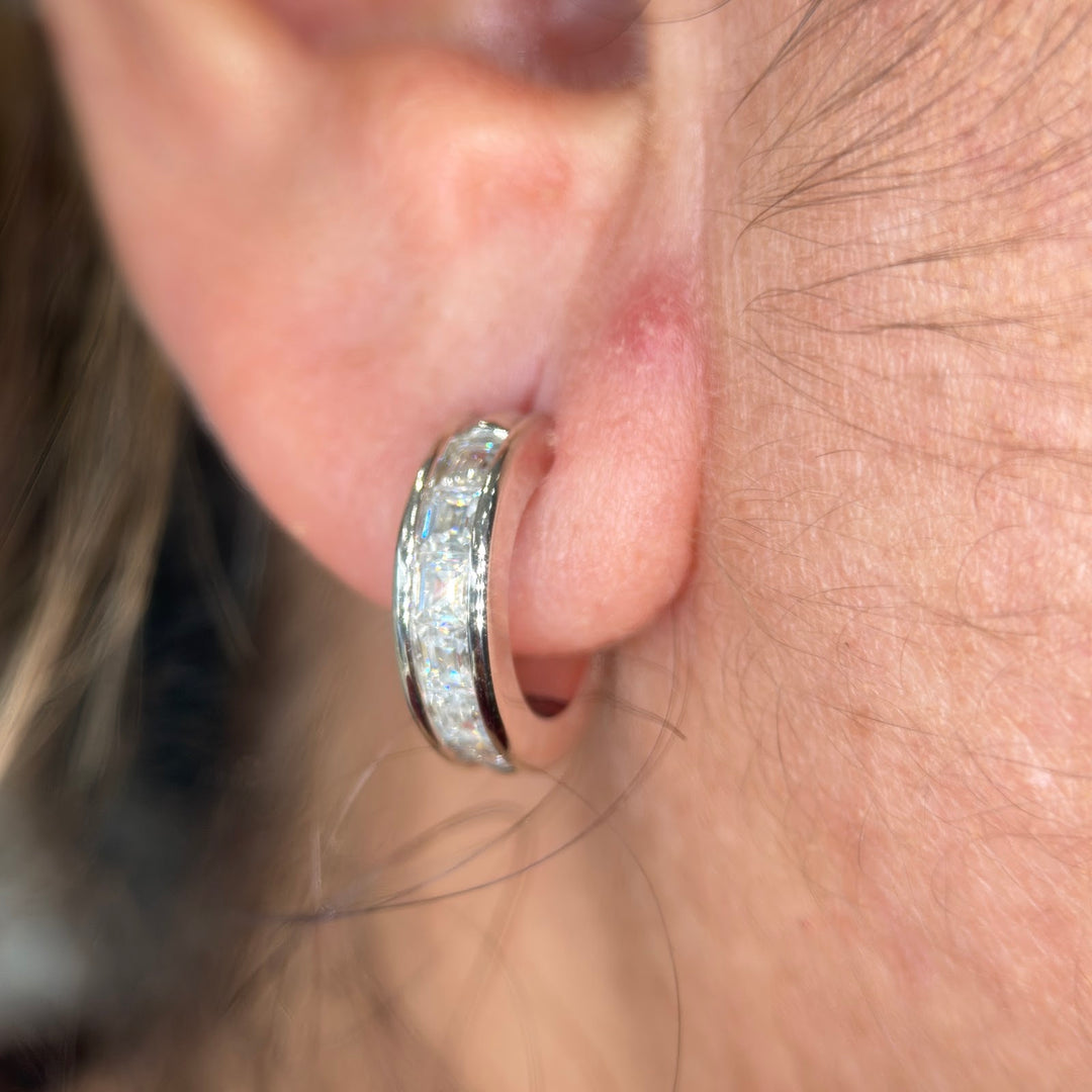 14k white gold moissanite three-quarter hoop worn on the ear