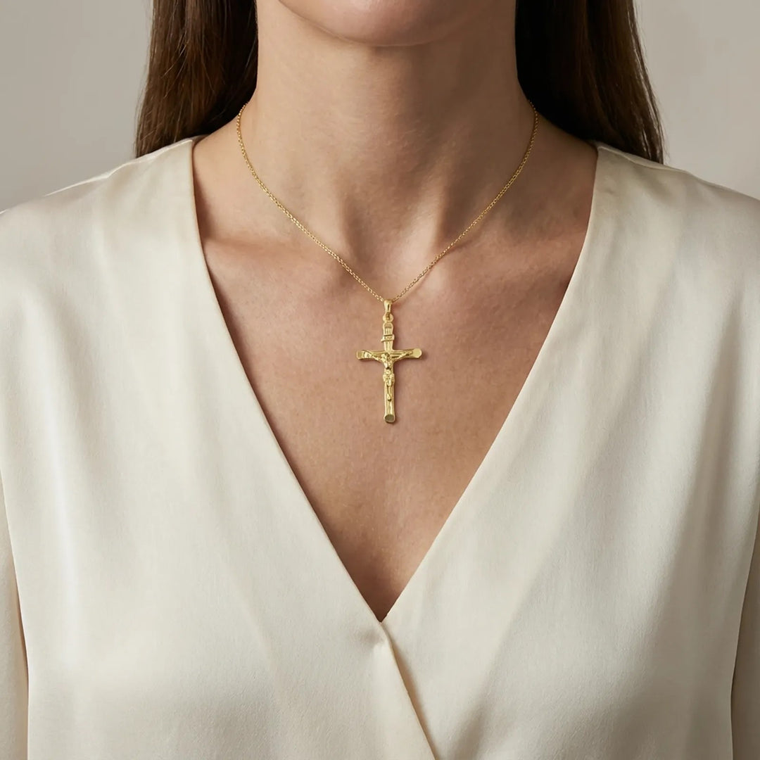 Tubular Crucifix Yellow Gold Cross Pendant worn on womens chest
