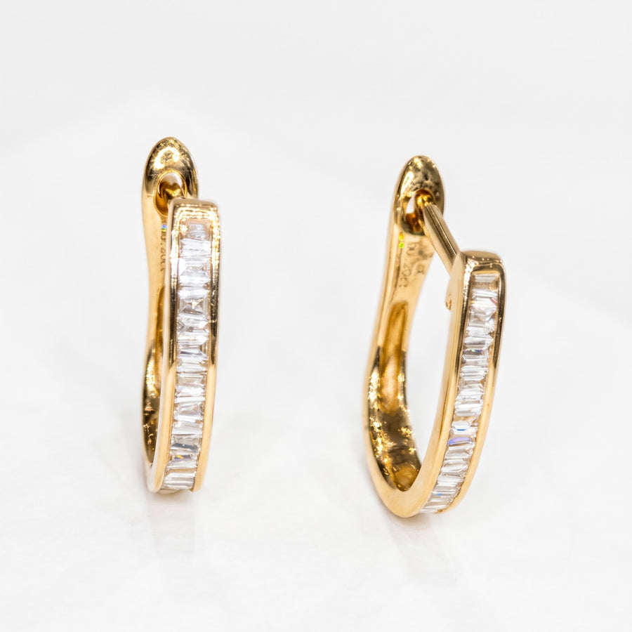 RUDIX 14k yellow gold natural diamond baguette huggie earrings — pair, diamond fronts toward camera, white studio background