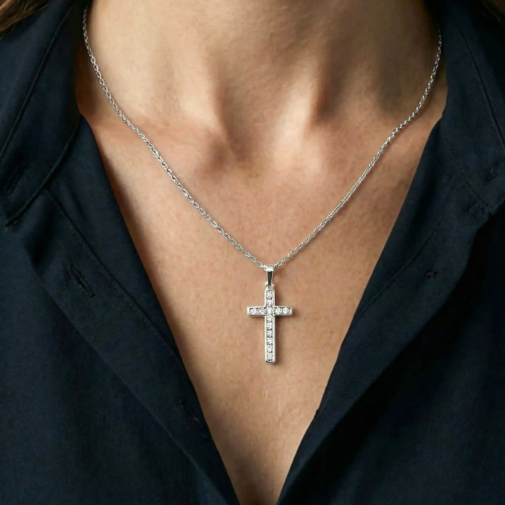 Minimal Latin White Gold Cross Pendant worn on womens chest