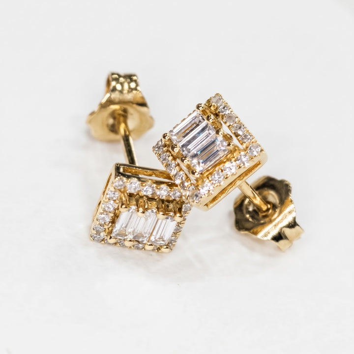 14k yellow gold natural diamond studs lying down, fronts and butterfly backs