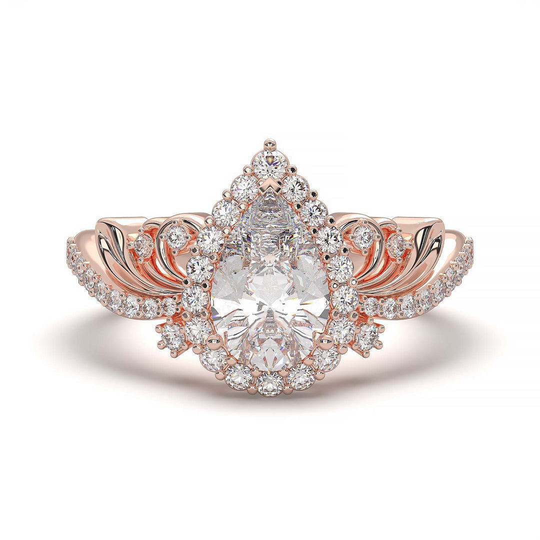 Pear-shaped diamond vintage engagement ring with custom prongs and halo design.