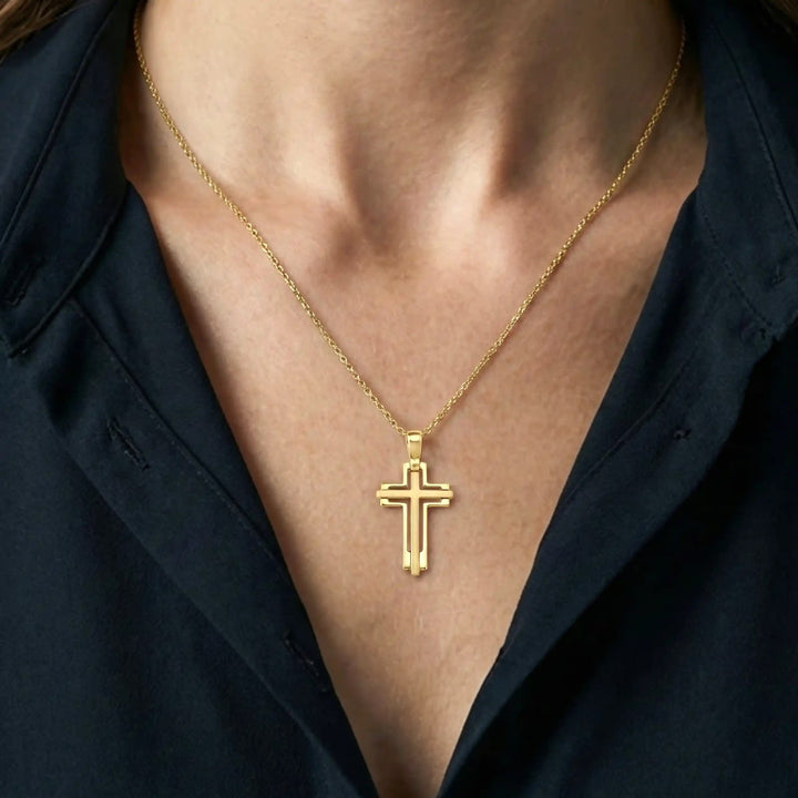 Layered Latin Yellow Gold Cross Pendant worn on womens chest