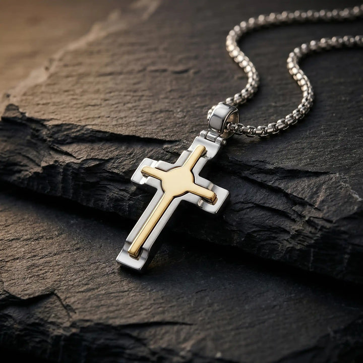 Layered Latin Two-Tone Gold Cross Pendant on stone