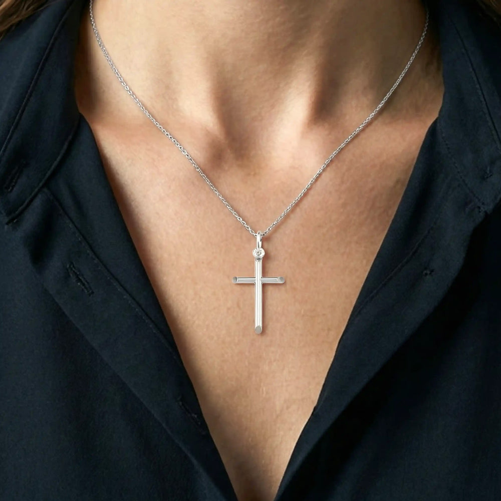 Tubular Latin White Gold Cross Pendant worn on womens chest