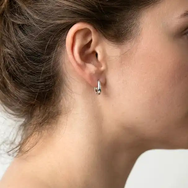 White Gold Oval Huggie Earrings - worn on ear