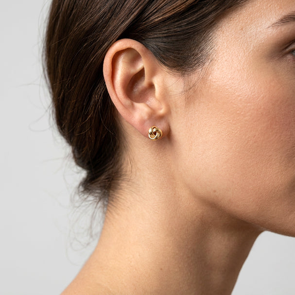 Yellow Gold Love Knot Stud Earrings - worn on ear