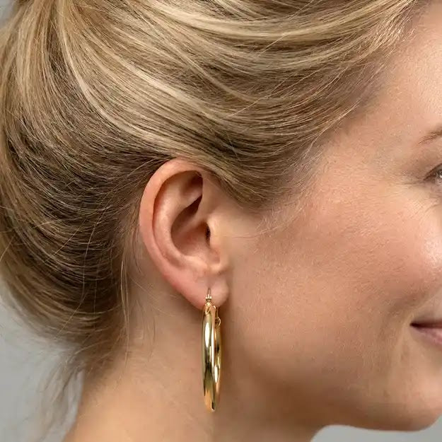 Yellow Gold Oval Tube Earrings - worn on ear
