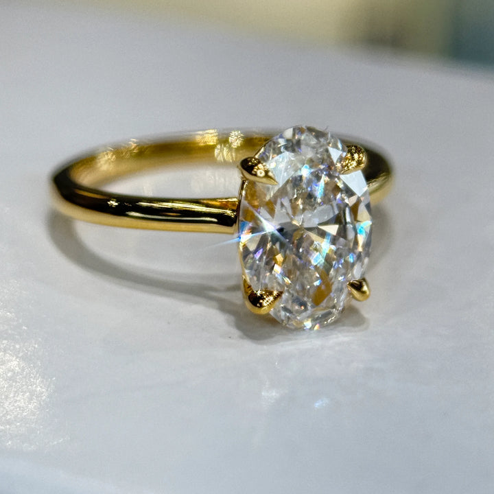Oval lab-grown diamond solitaire engagement ring in 14k yellow gold