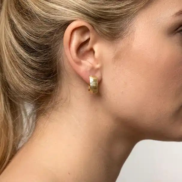 Yellow Gold Patterned Huggie Earrings - worn on ear