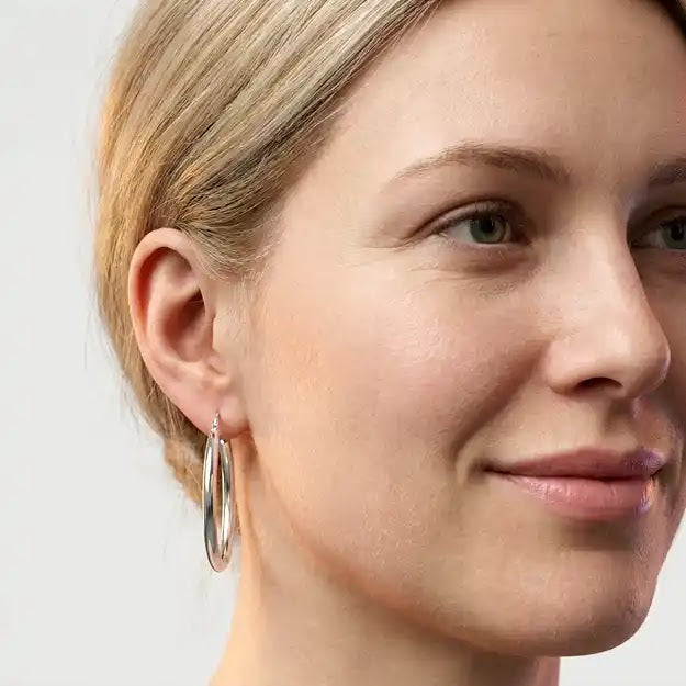 White Gold High Polish Oval Hoop Earrings, 16.4mm - worn on ear