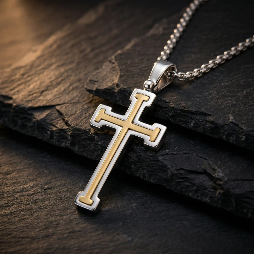 Layered Latin Two-Tone Gold Cross Pendant on stone