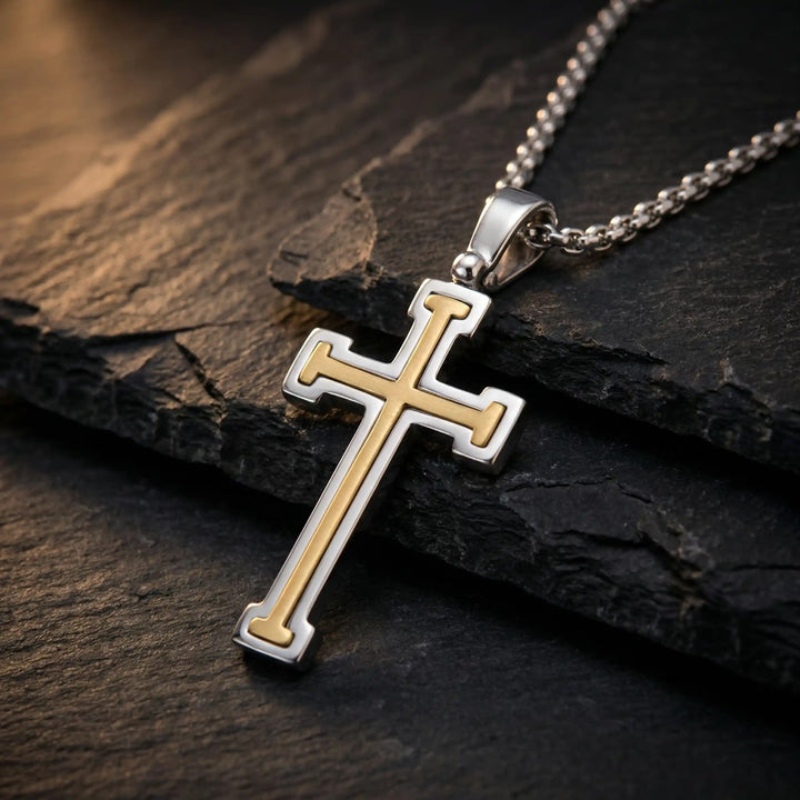 Layered Latin Two-Tone Gold Cross Pendant on stone