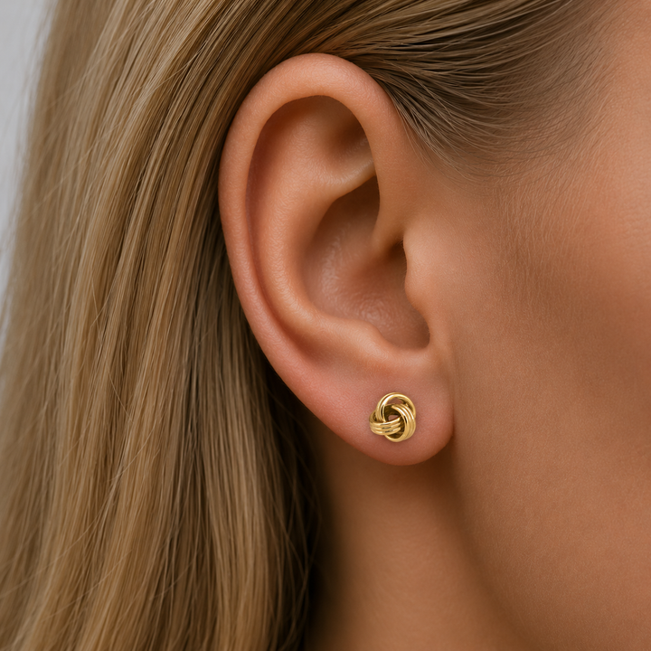 Yellow Gold Love Knot Stud Earrings - worn on ear